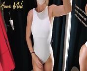 A girl with a perfect figure in a fitting room trying on different sexy tight dresses from anna zapala lingerie try onan xxx father