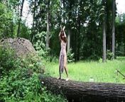 Nude dance on felled tree from hanging nude by a tree